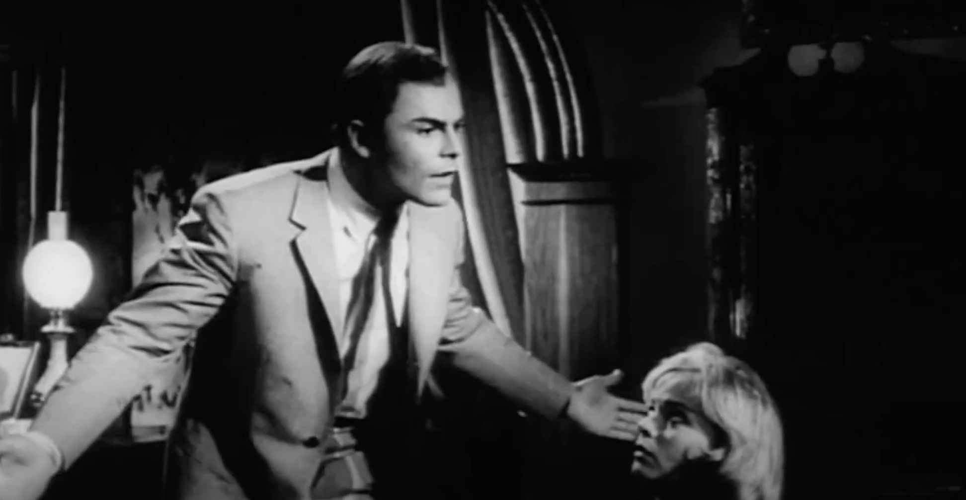 John Saxon as the male lead in The Evil Eye